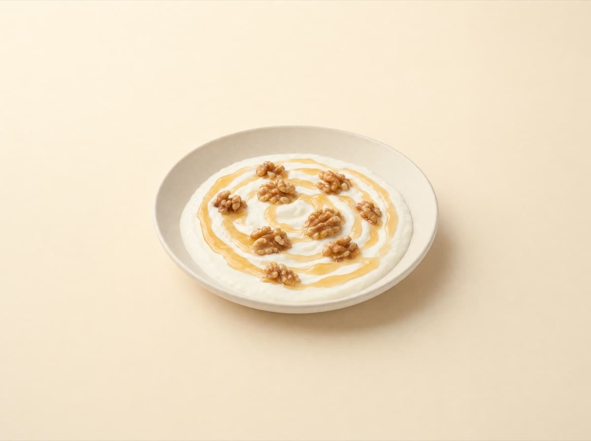 The plate: yogurt with honey and walnuts.