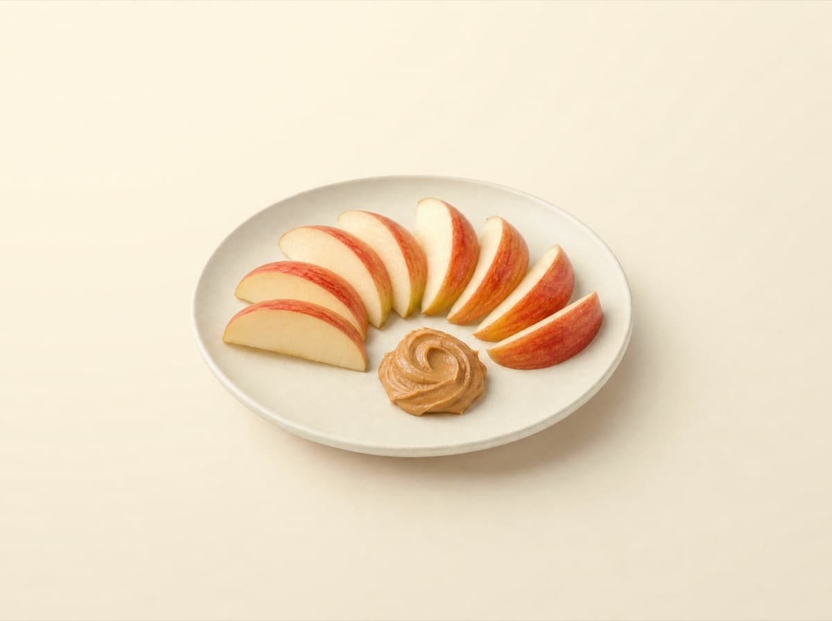 The plate: apple with peanut butter.