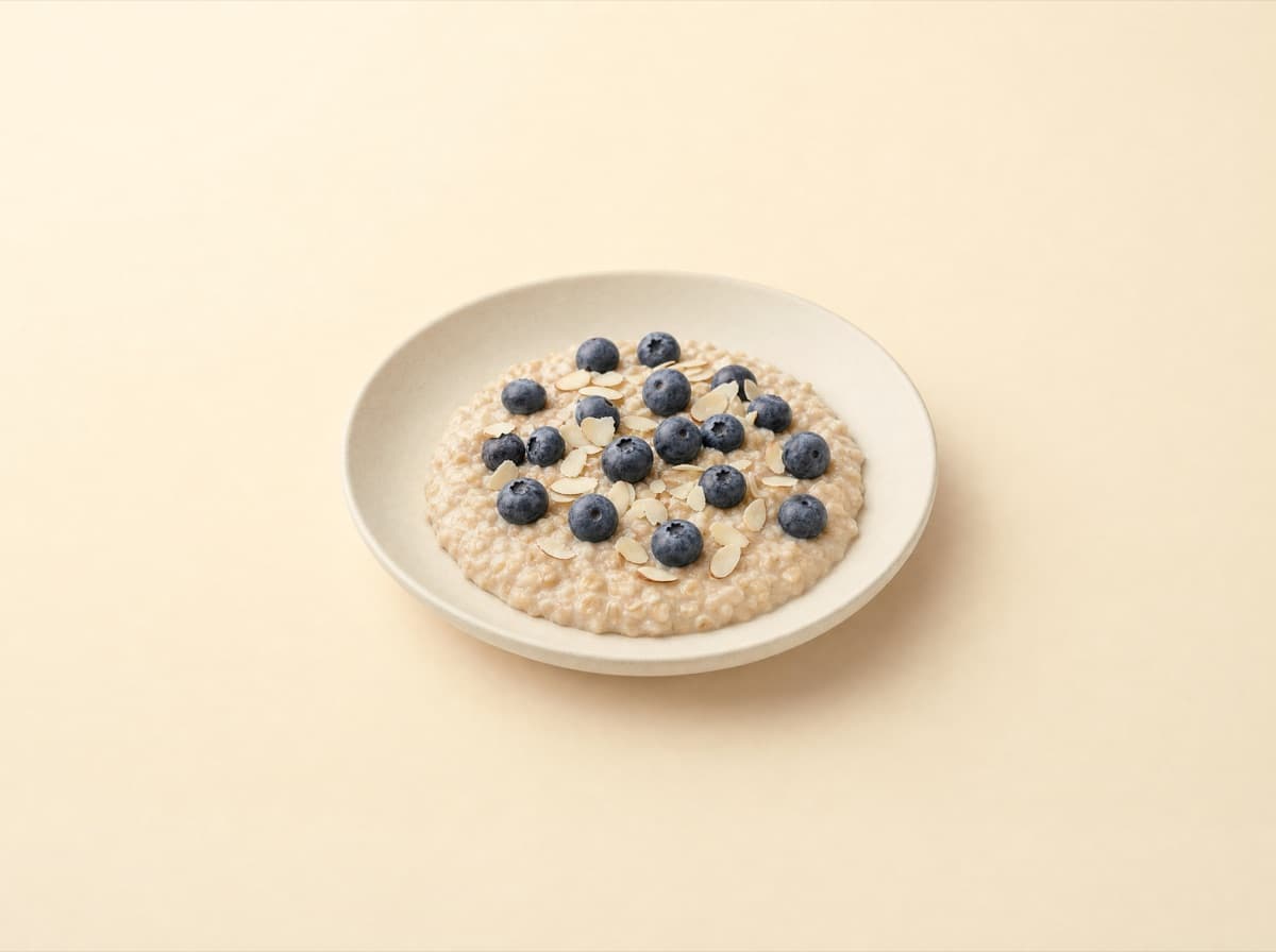 The plate: oat porridge with almond drink and blueberries.
