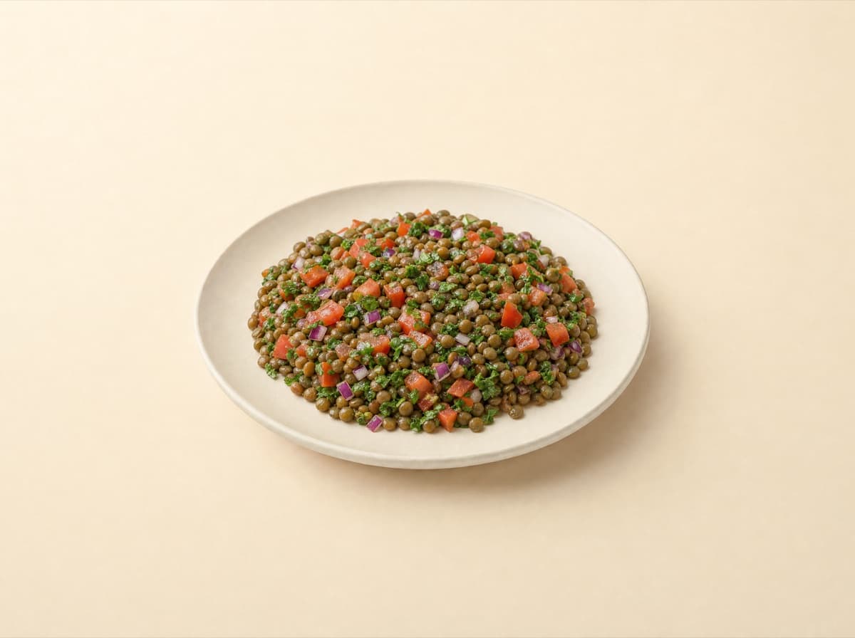 The plate: lentil salad with tomato and red onion.